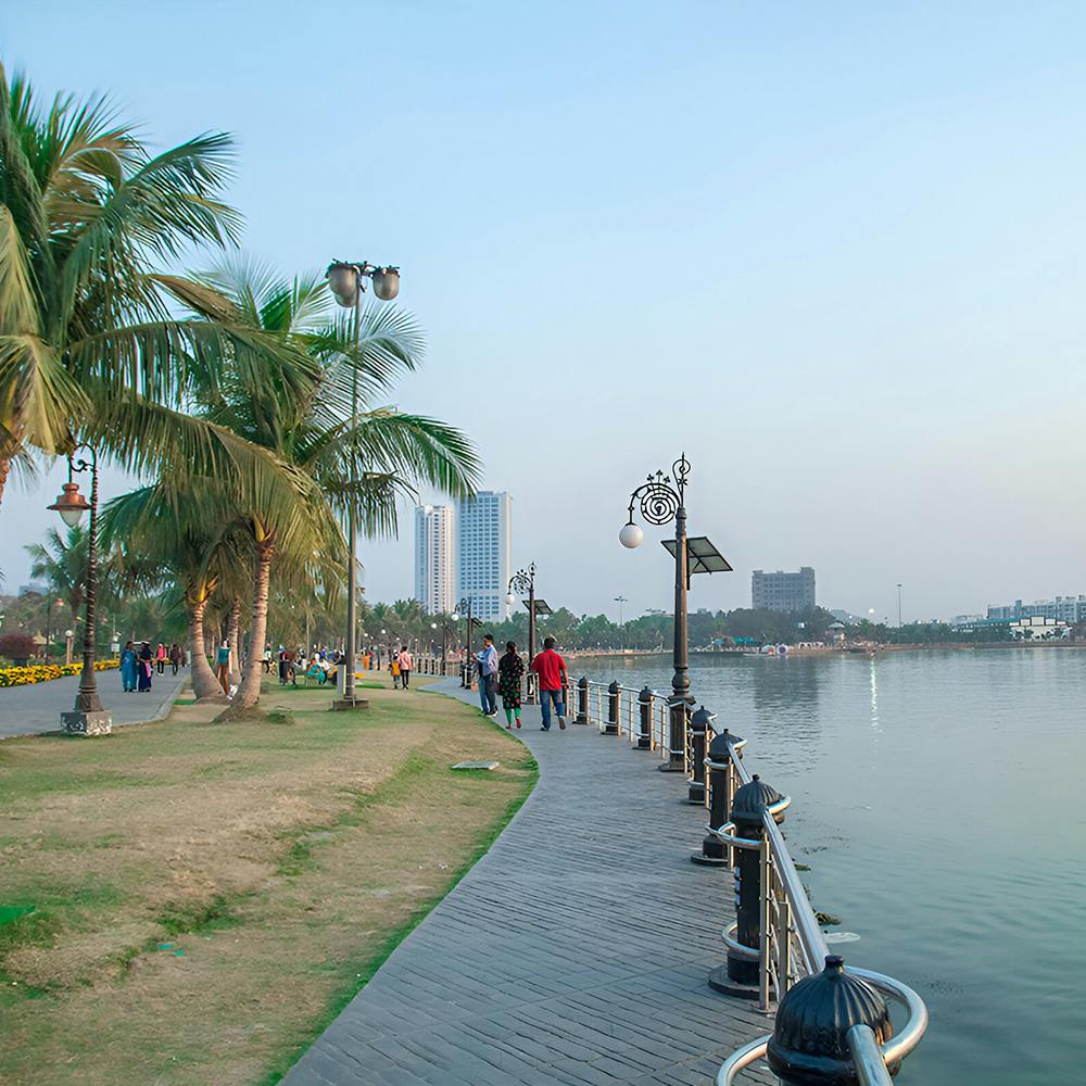 Water,Sky,Plant,Tree,Street light,Arecales,Lake,Travel,Leisure,City