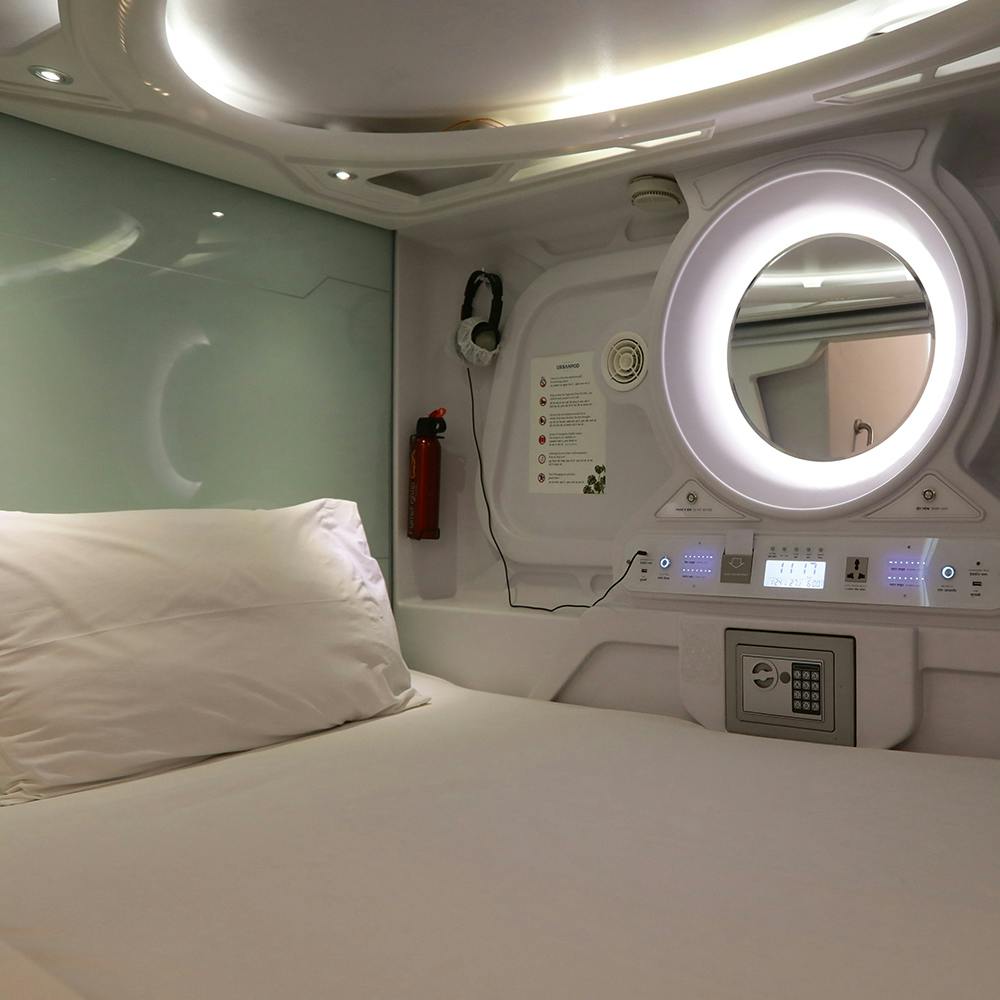 Interior design,Cabin,Comfort,Building,Air travel,Pillow,Airline,Ceiling,Bedding,Room