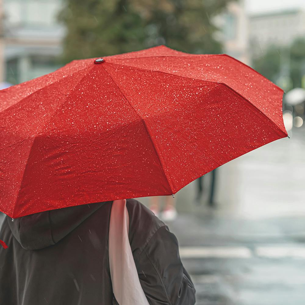 Water,Outerwear,Umbrella,Sleeve,Material property,Red,Tints and shades,Travel,Precipitation,Event