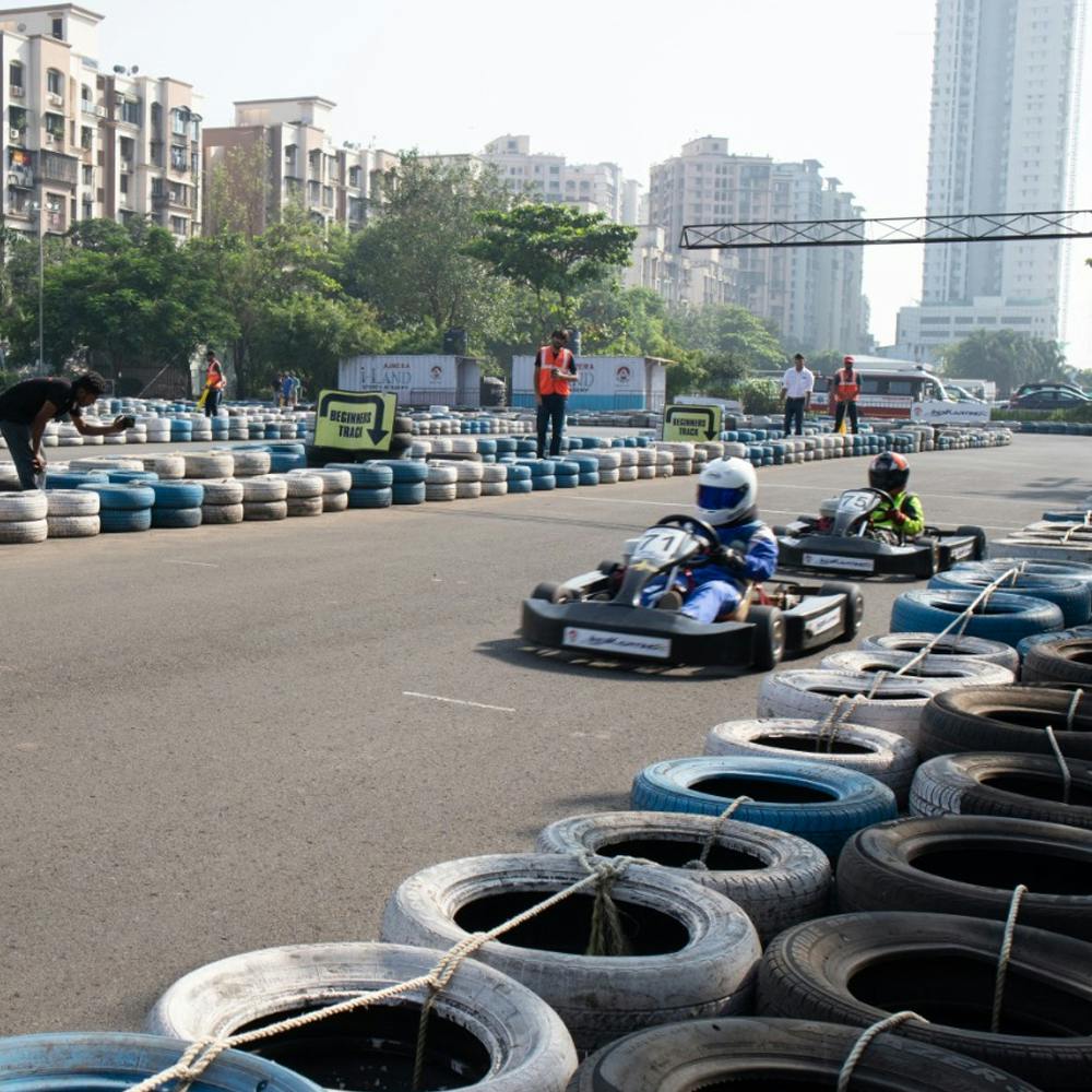 Tire,Daytime,Building,Automotive tire,Motor vehicle,Automotive design,Vehicle,Infrastructure,Asphalt,Sky