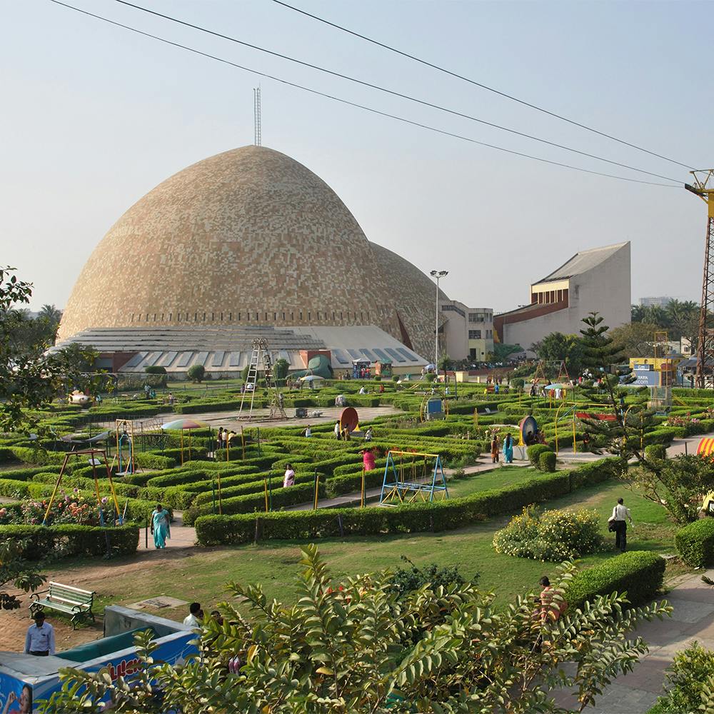 Plant,Sky,Building,Architecture,Biome,Urban design,Landscape,Grass,Stupa,Dome